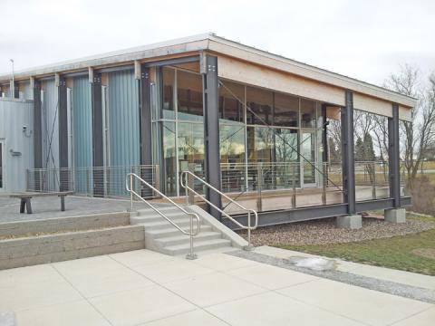 <p>The outside of the building includes permeable pavers, rain gardens, and a living roof and wall.</p>