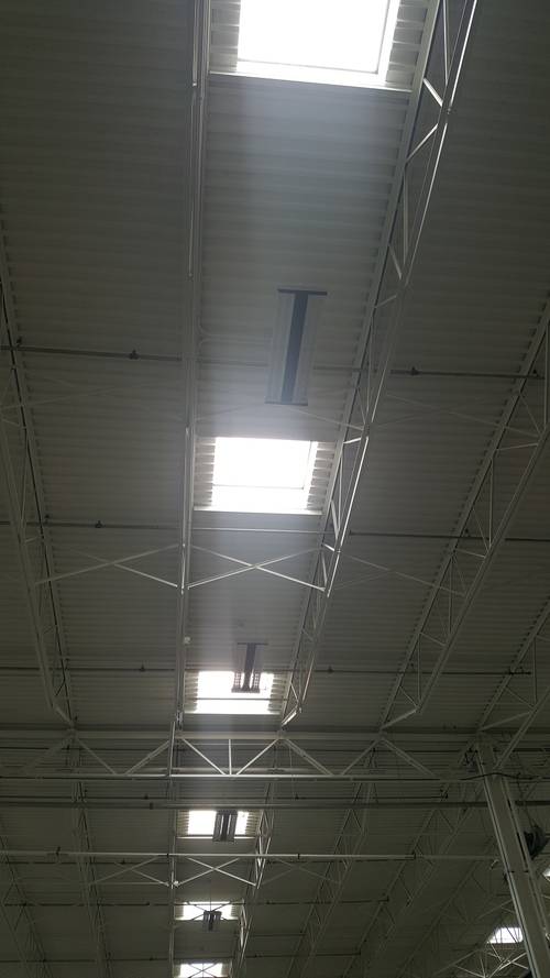 <p>There are skylights throughout the building. Lights are on daylight sensors so not many were on.</p>